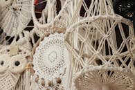 Detailed close-up of intricate boho macrame art with varied patterns and hanging designs.
